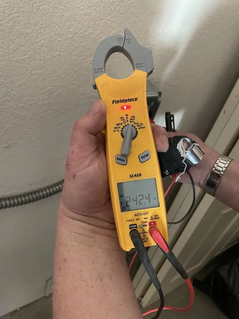 Voltage testing with clamp meter during Ceiling Fan Installation in Fabens